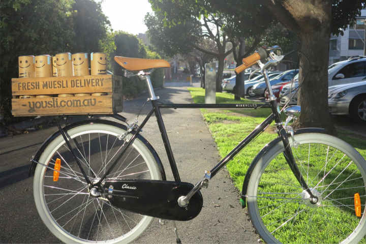 A cruiser bike with a french basket for delivering Yousli muesli
