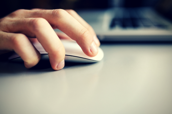 someone using a mouse and keyboard