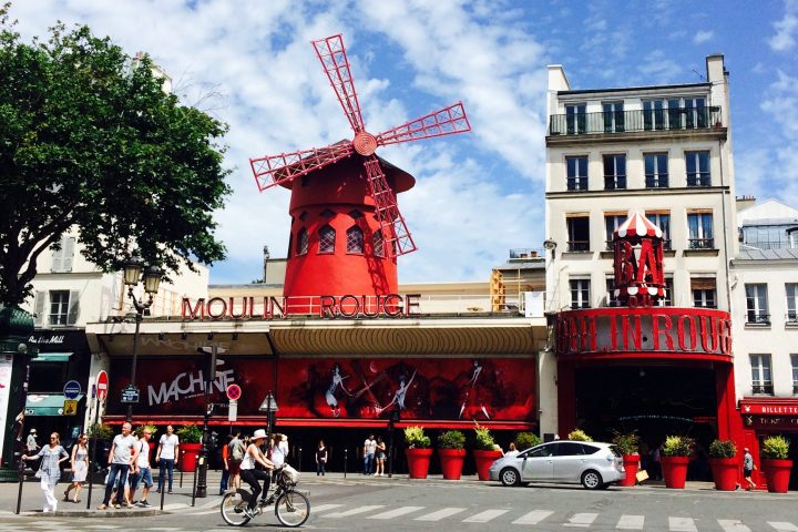The Moulin Rouge with blue sky behind it