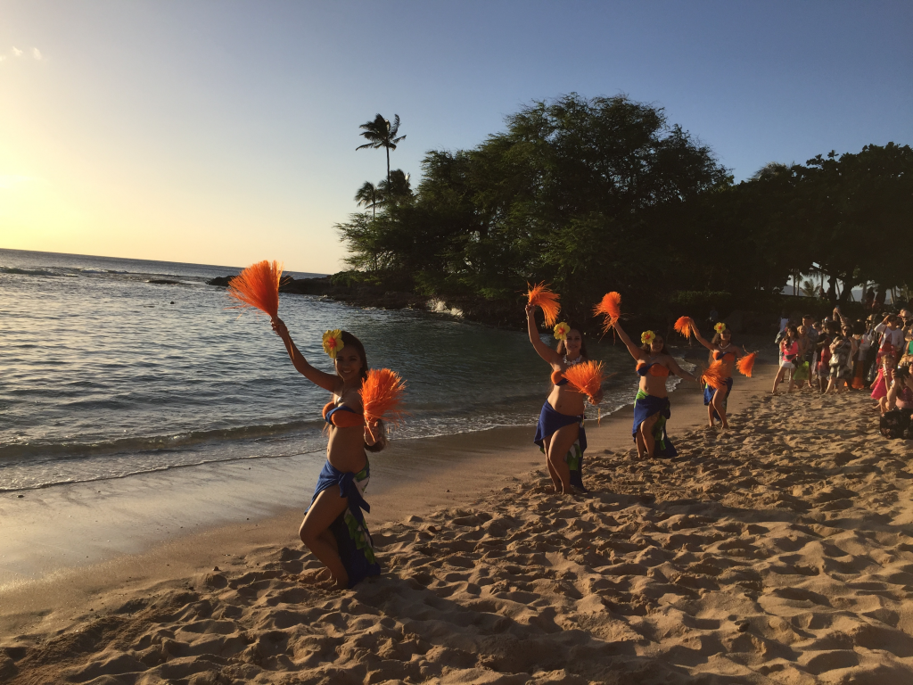 Polynesian dancers in saris and bikini tops